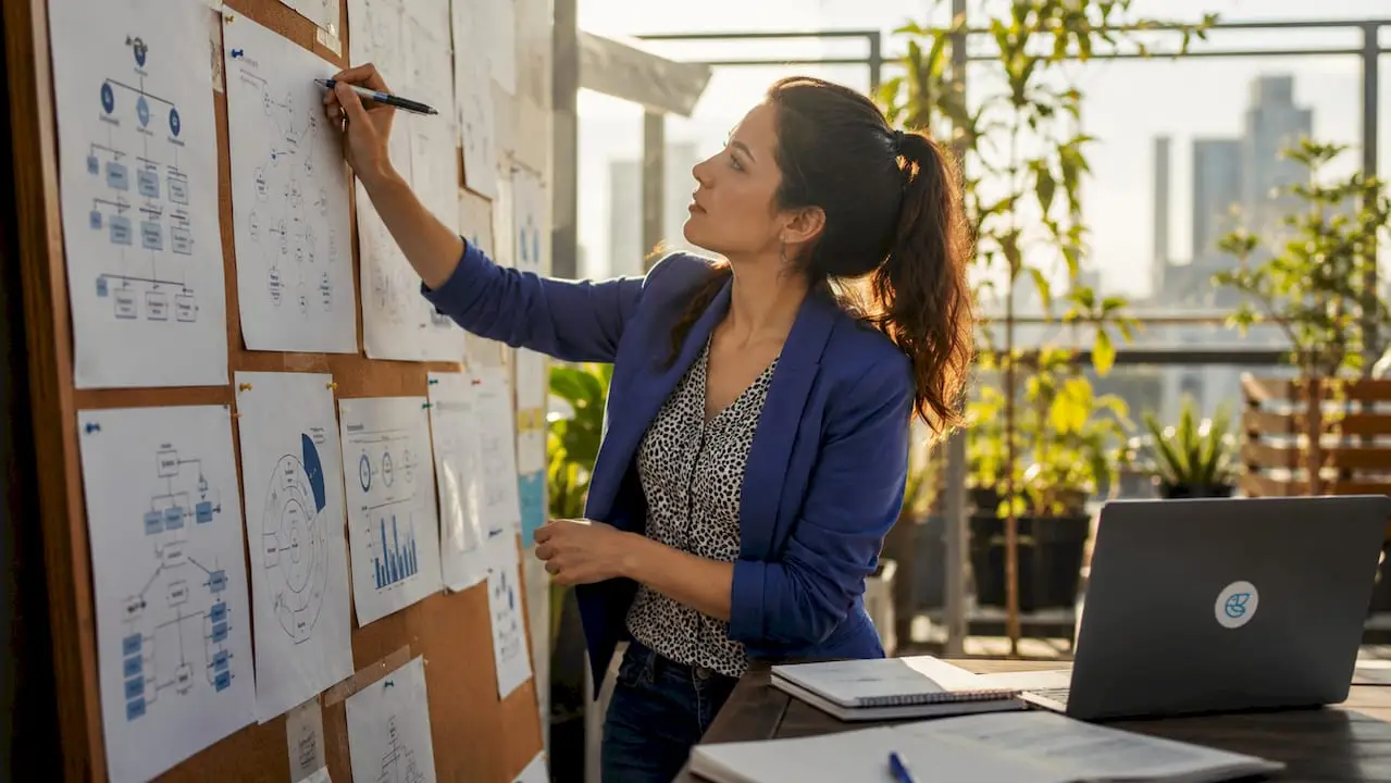 Tech leader reviewing team scaling plans at desk