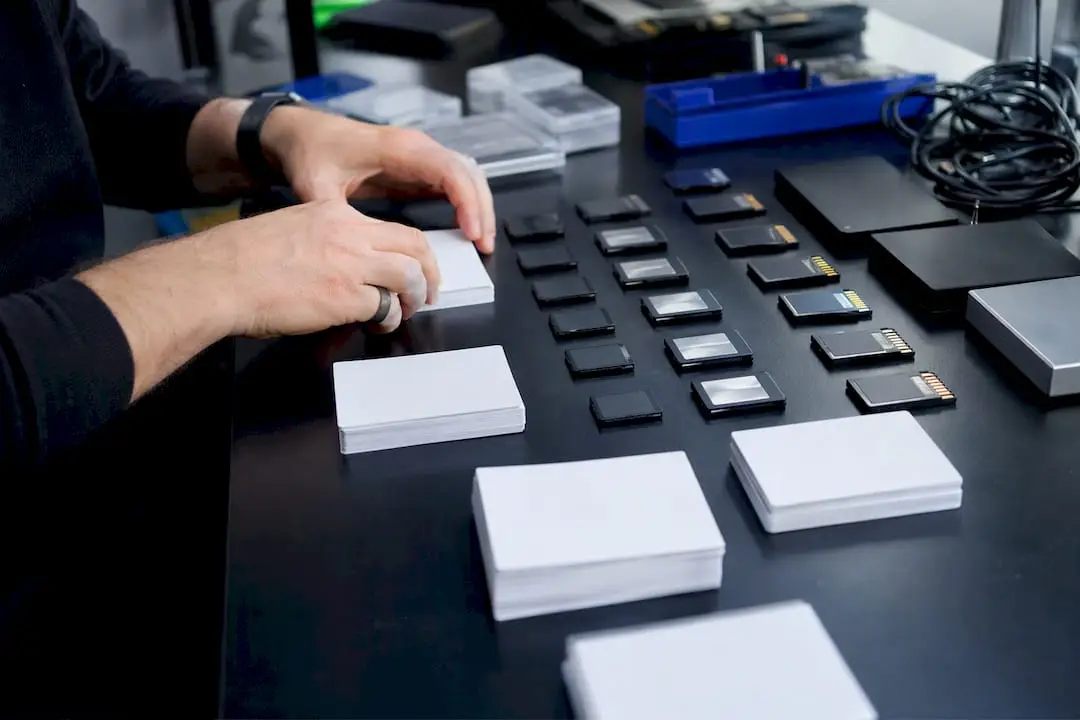 Hands organizing digital data storage units